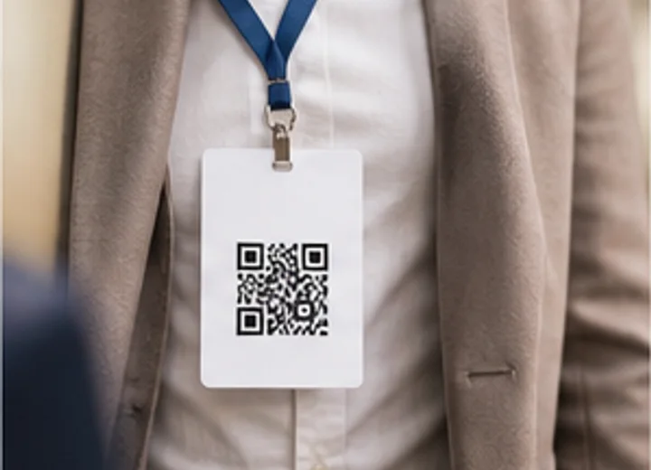 Event badge on a lanyard with a QR code